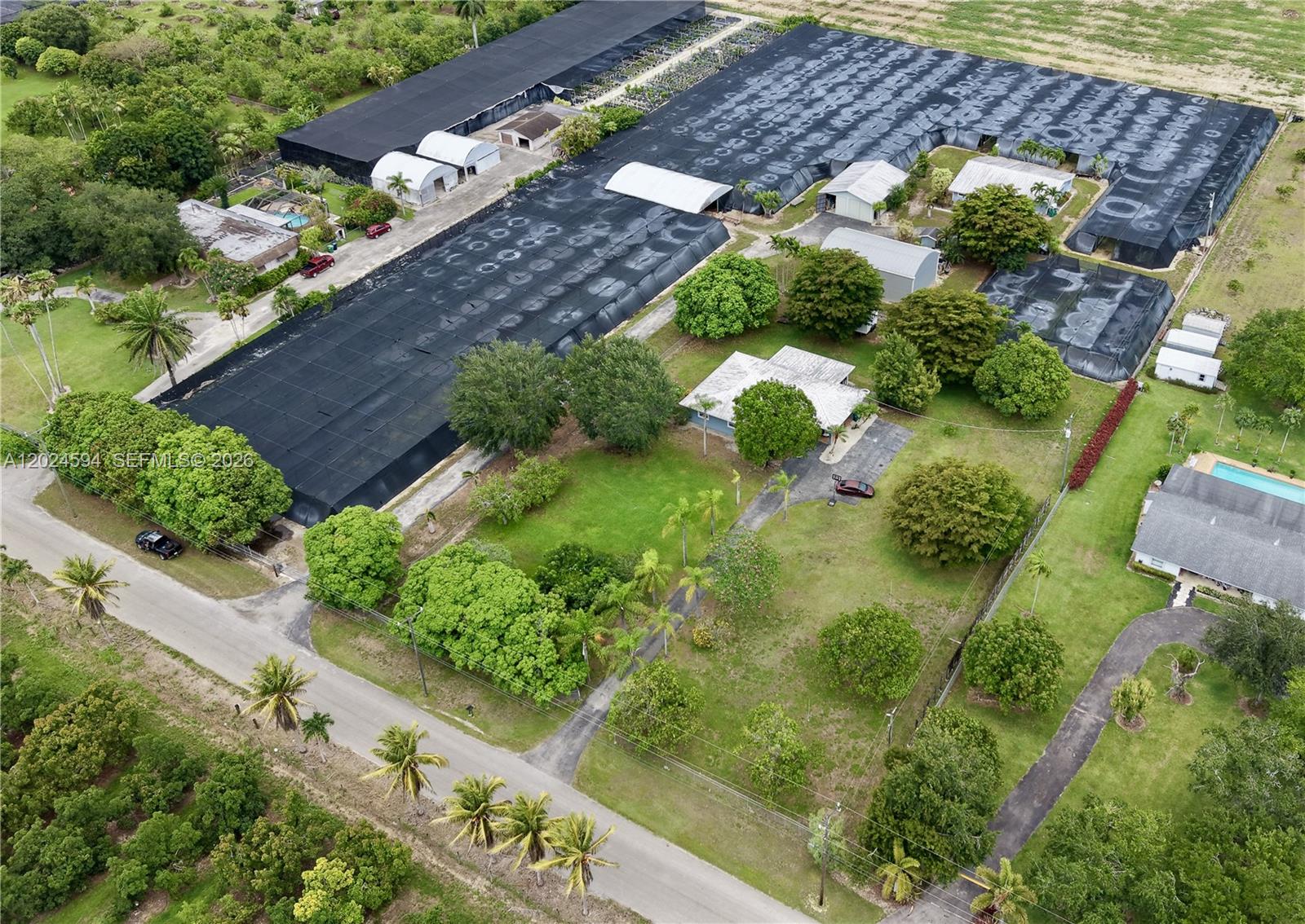 17355 Southwest 256th Street Homestead, FL 33031 - Photo 2 of 32 an aerial view of a house