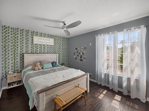 a bedroom with a bed and a window