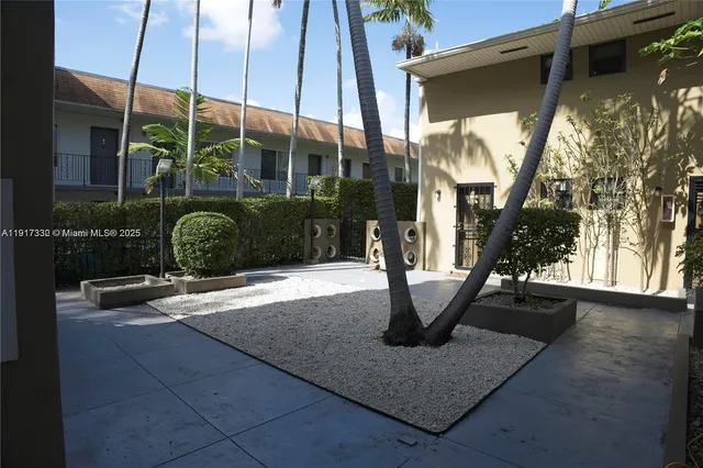 a view of building with a window and balcony