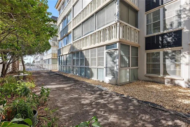 a kitchen with white cabinets sink and white appliances