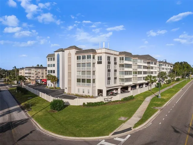 a view of a hallway view with wooden floor and staircase