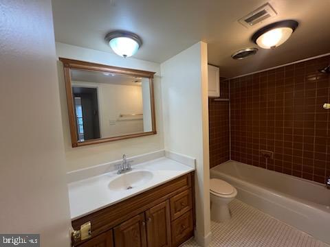 8489 Greenbelt Road, Unit 202 Greenbelt, MD 20770 - Photo 7 of 10 a bathroom with a sink toilet vanity and shower