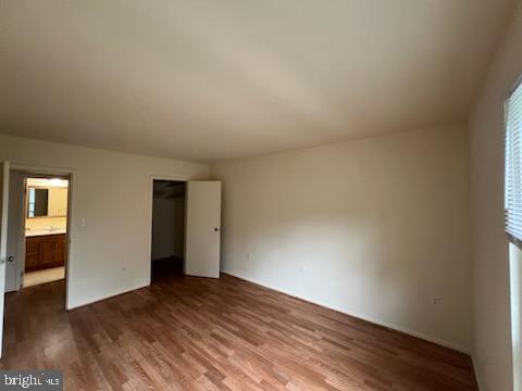 8489 Greenbelt Road, Unit 202 Greenbelt, MD 20770 - Photo 8 of 10 a view of an empty room and wooden floor