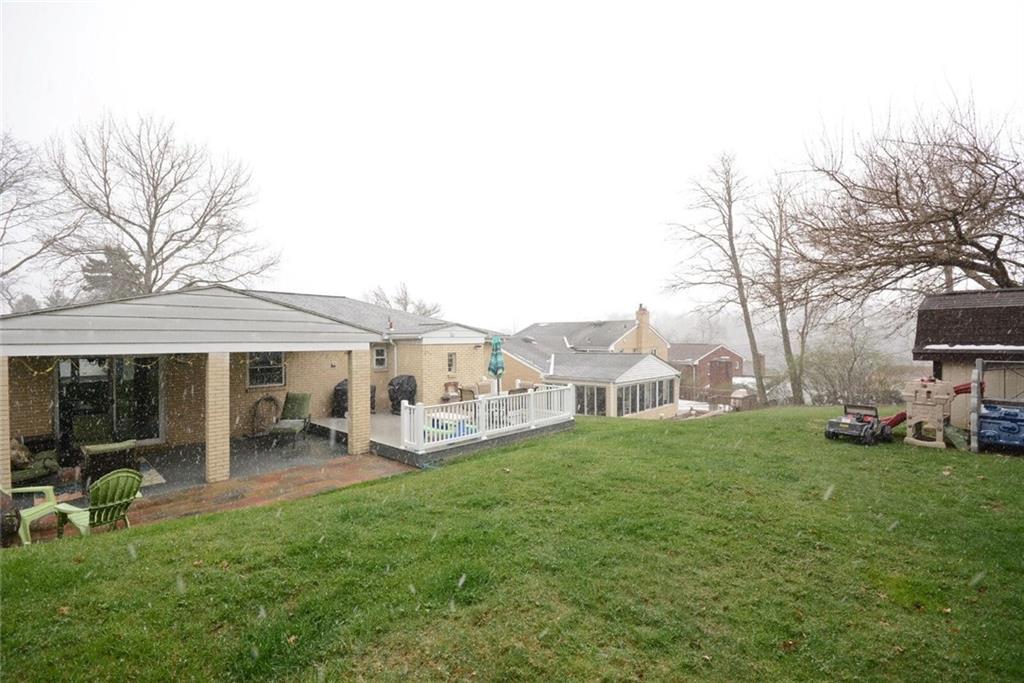 2428 Rose Garden Road Pittsburgh, PA 15220 - Photo 24 of 25 Lots of outdoor living space with covered patio and platform deck with LARGE tiered back yard and shed for storage.