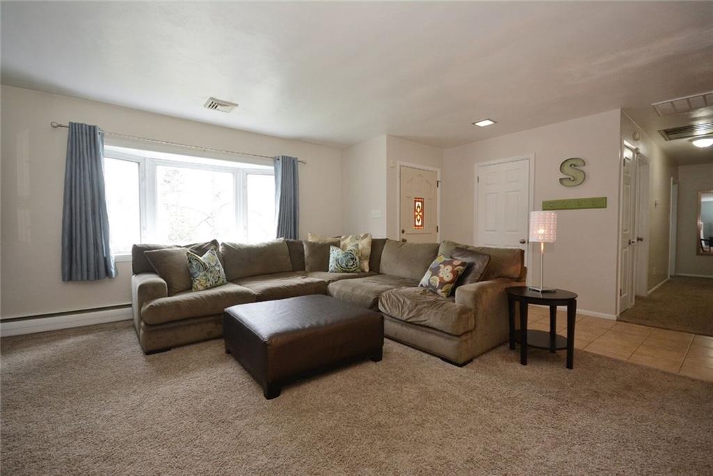 2428 Rose Garden Road Pittsburgh, PA 15220 - Photo 4 of 25 Large Living Room with HUGE Bay Window that floods the room with light. Newer carpeting.