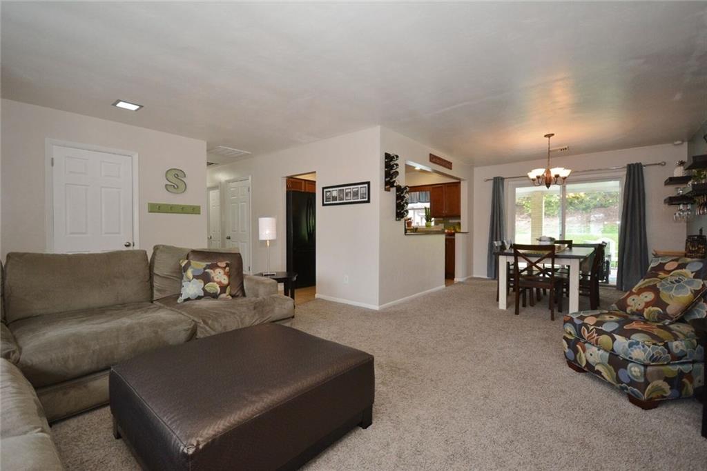 2428 Rose Garden Road Pittsburgh, PA 15220 - Photo 5 of 25 Huge Living Room opens up directly into the dining room with kitchen pass-through door way gives you the open concept feel everyone loves.