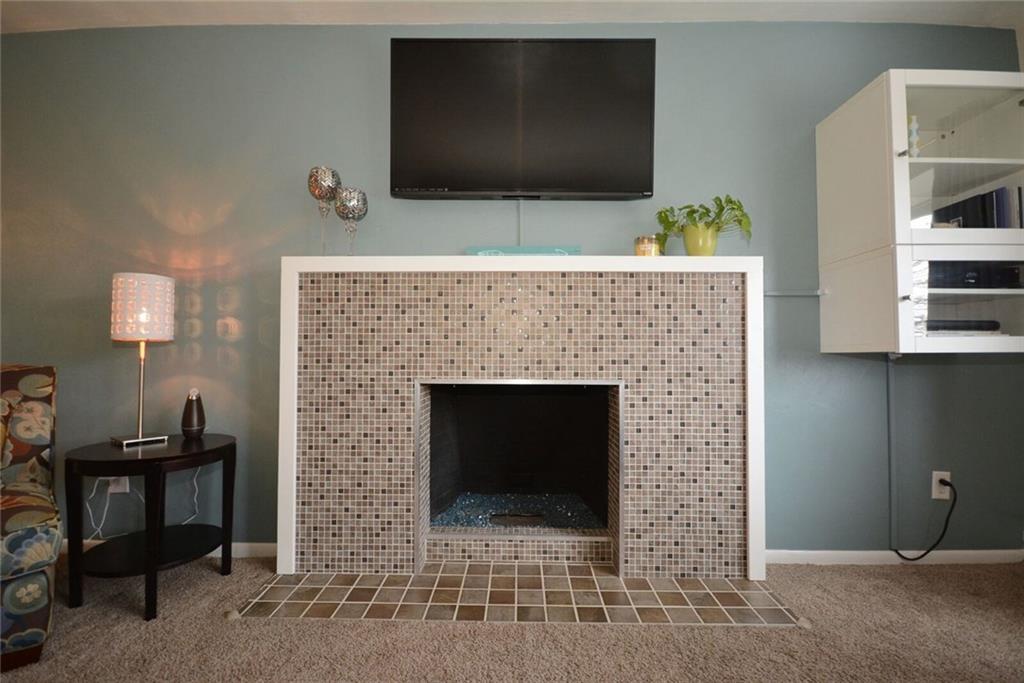 2428 Rose Garden Road Pittsburgh, PA 15220 - Photo 7 of 25 Recently updated mosaic glass tiled ventless gas fireplace