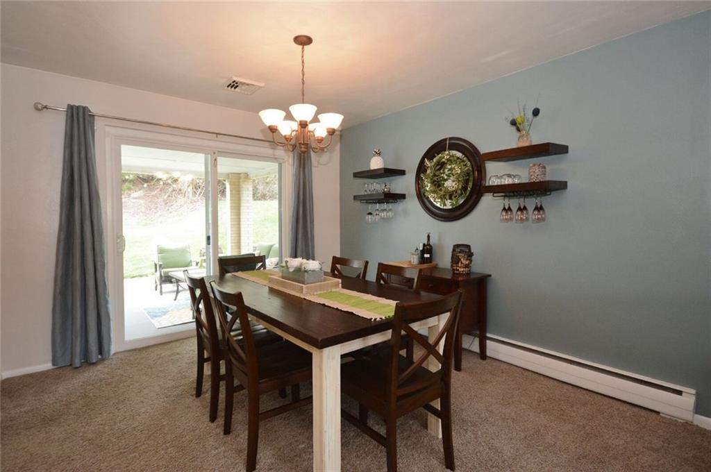 2428 Rose Garden Road Pittsburgh, PA 15220 - Photo 8 of 25 Spacious dining room with sliding glass doors lead out to the covered patio