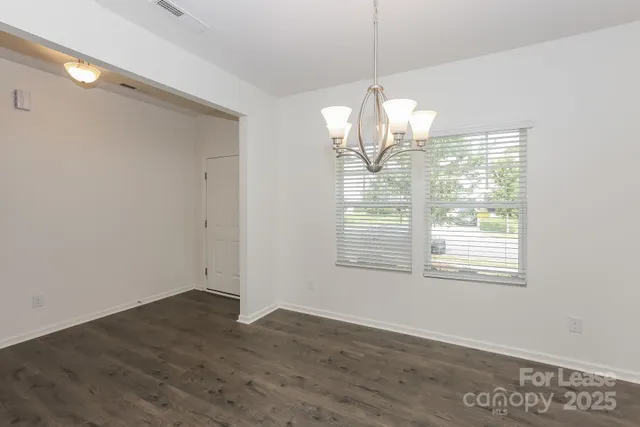 a kitchen with stainless steel appliances granite countertop a sink refrigerator and microwave