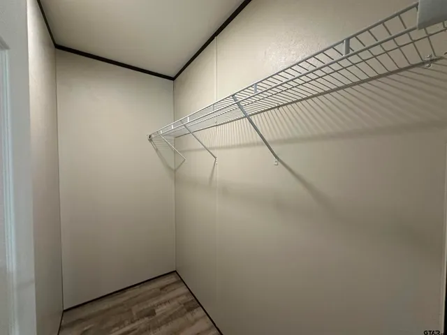 a view of a room with racks on the wall