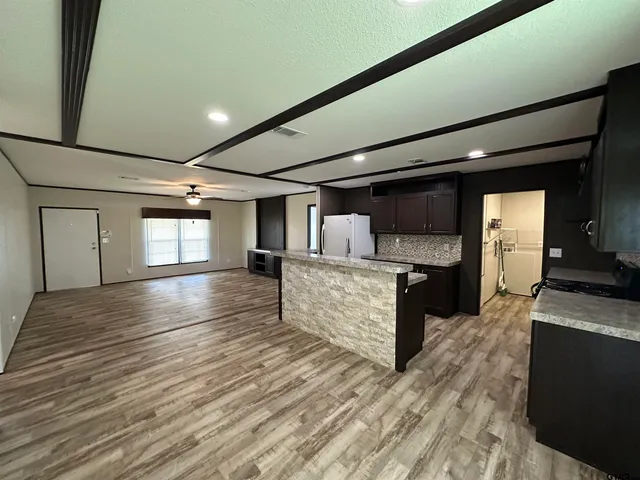 a view of kitchen with sink and cabinets