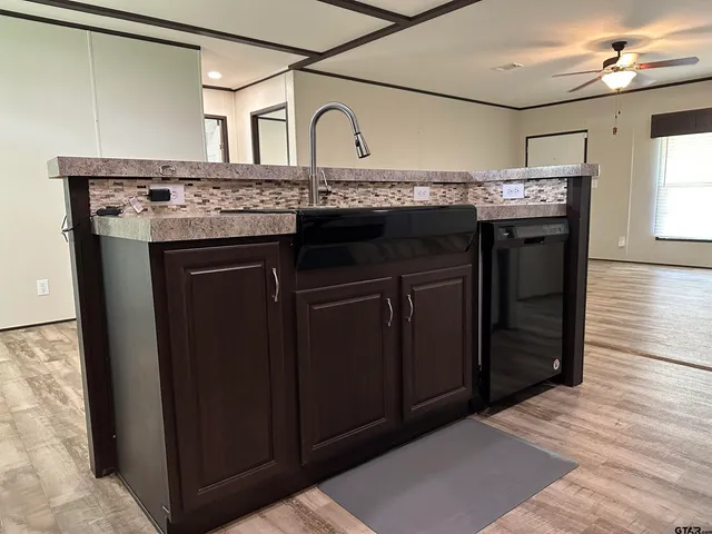 a kitchen with a stove and a refrigerator