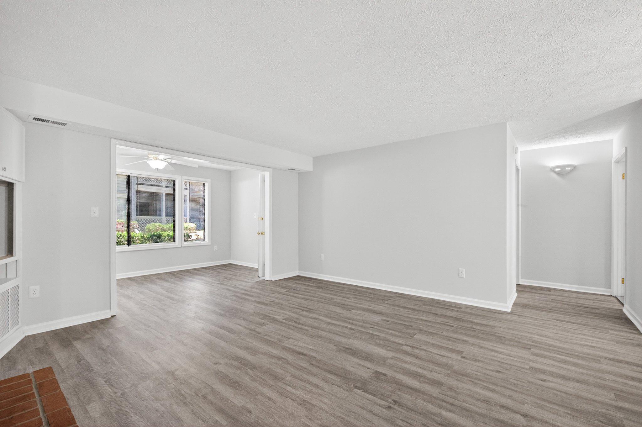 2281 Hunter's Run Drive, Unit 2281 Reston, VA 20191 - Photo 8 of 25 Living room connects to Sunroom