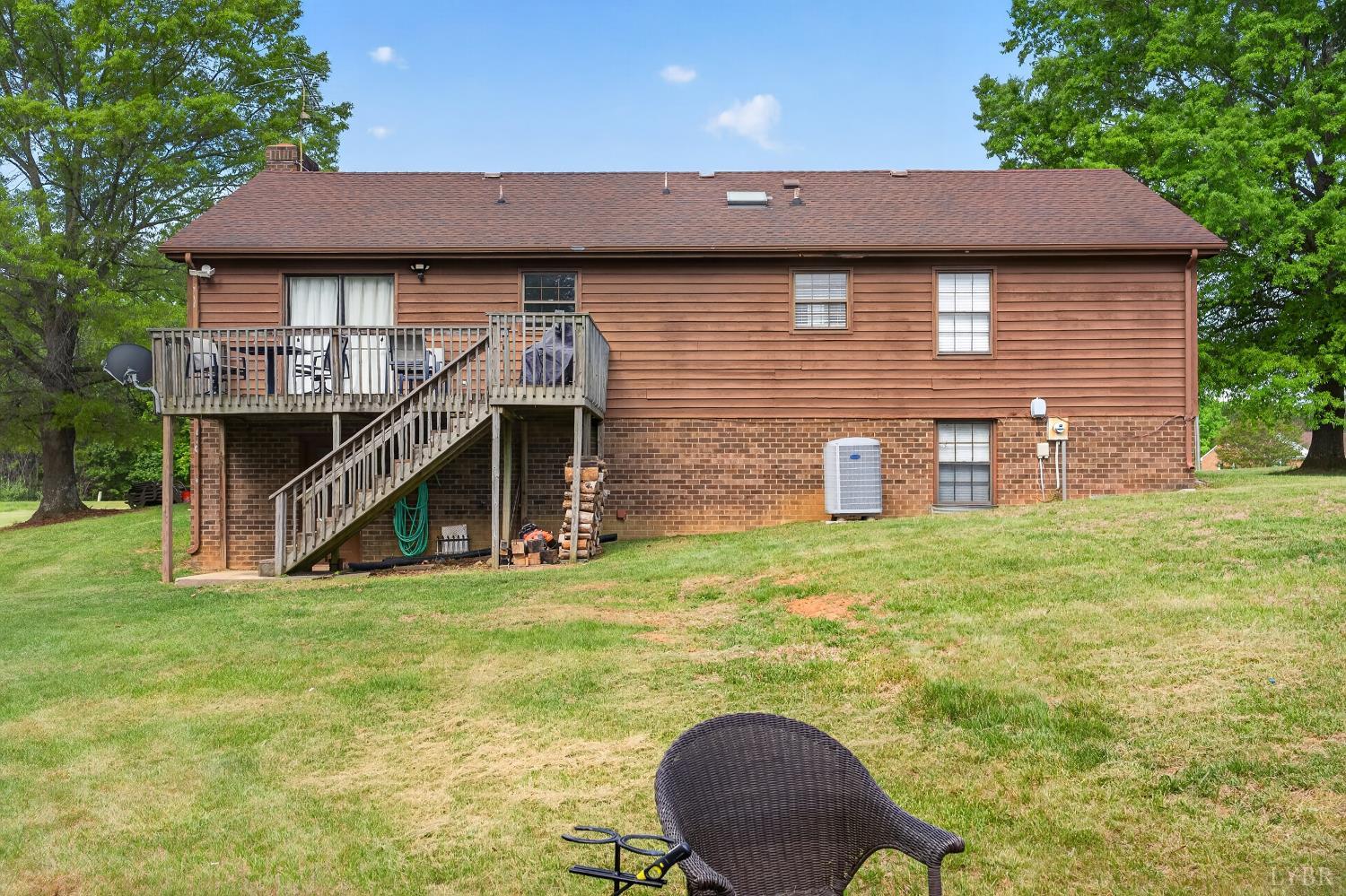 1002 Homeplace Road Rustburg, VA 24588 - Photo 43 of 48 a backyard of a house with table and chairs