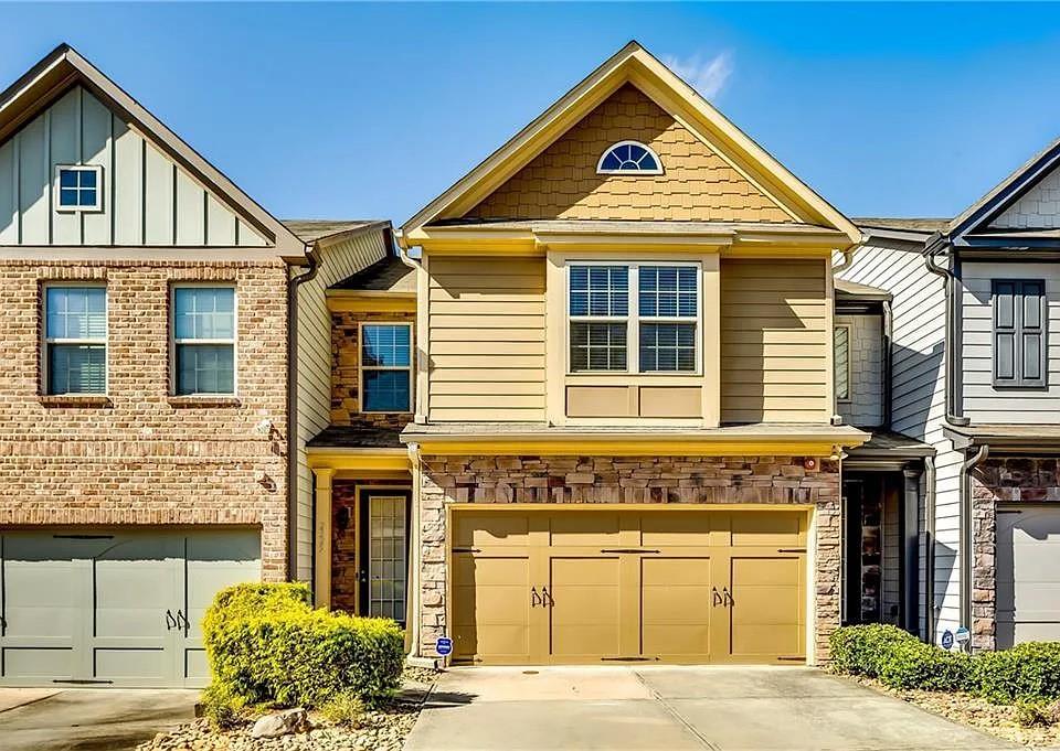 a front view of a house with a yard