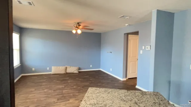 a very nice looking room with a ceiling fan
