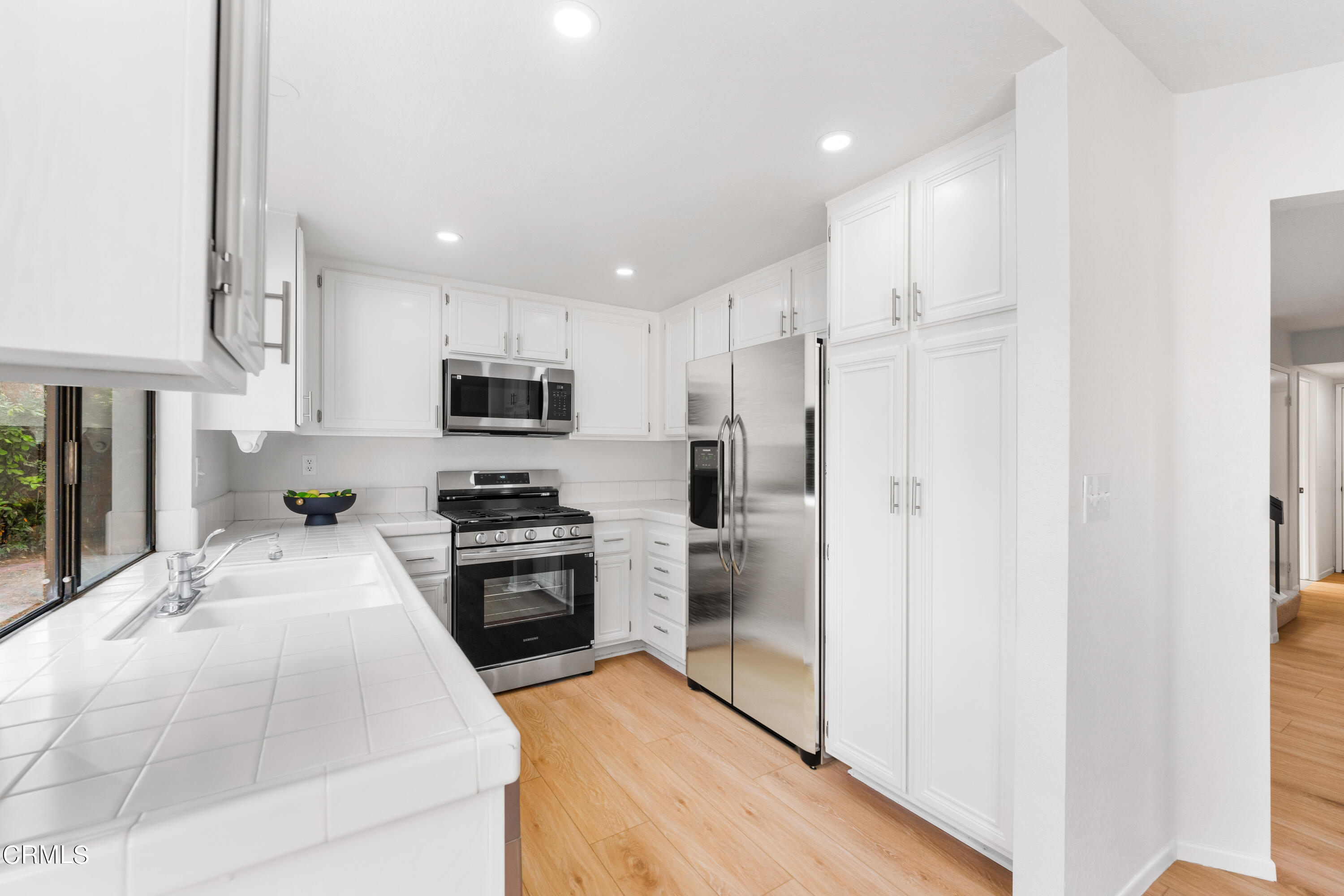 24 Silkberry Irvine, CA 92614 - Photo 12 of 33 a kitchen with granite countertop a refrigerator a stove top oven a sink and dishwasher