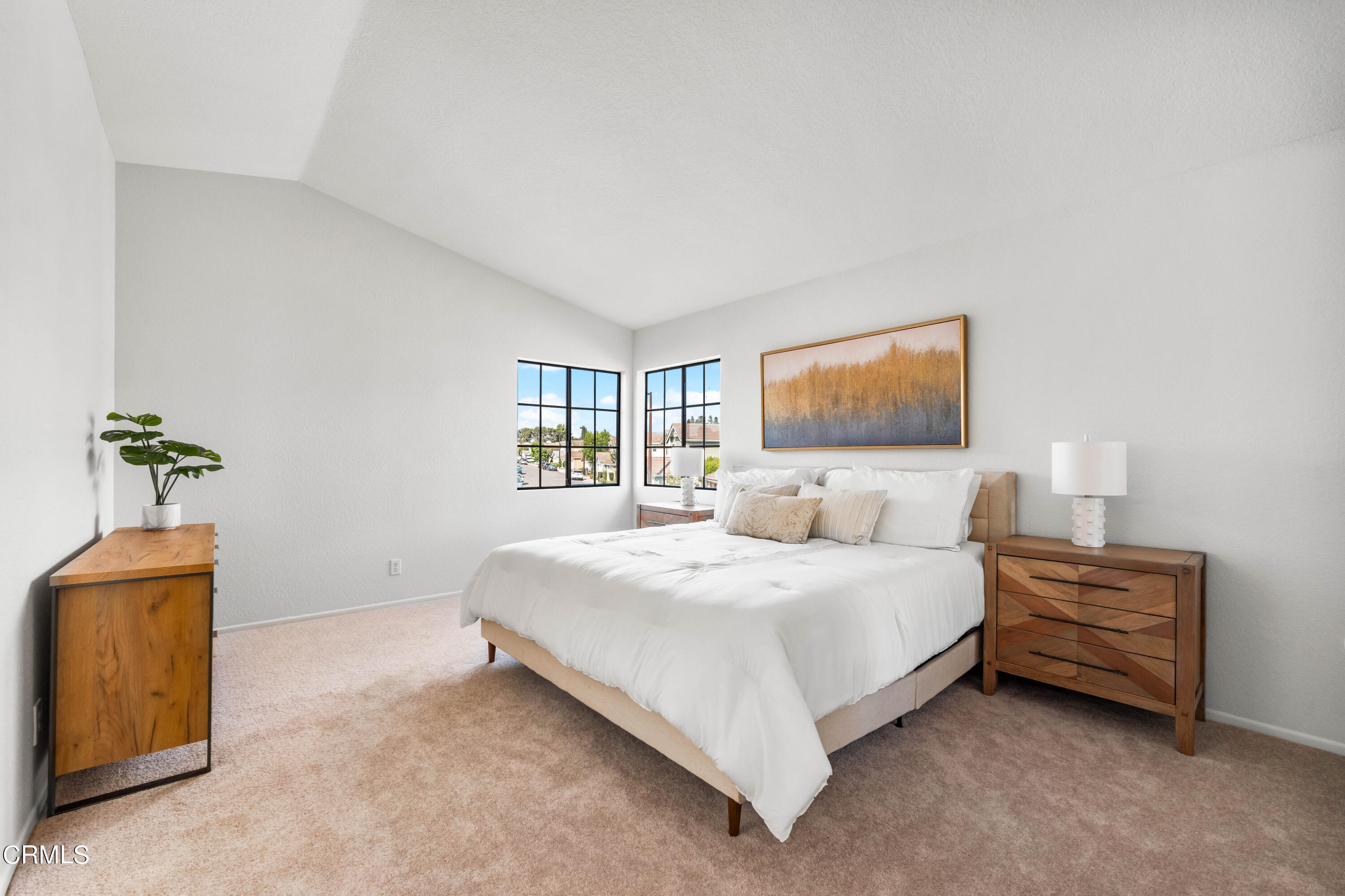 24 Silkberry Irvine, CA 92614 - Photo 16 of 33 a spacious bedroom with a bed and a flat screen tv