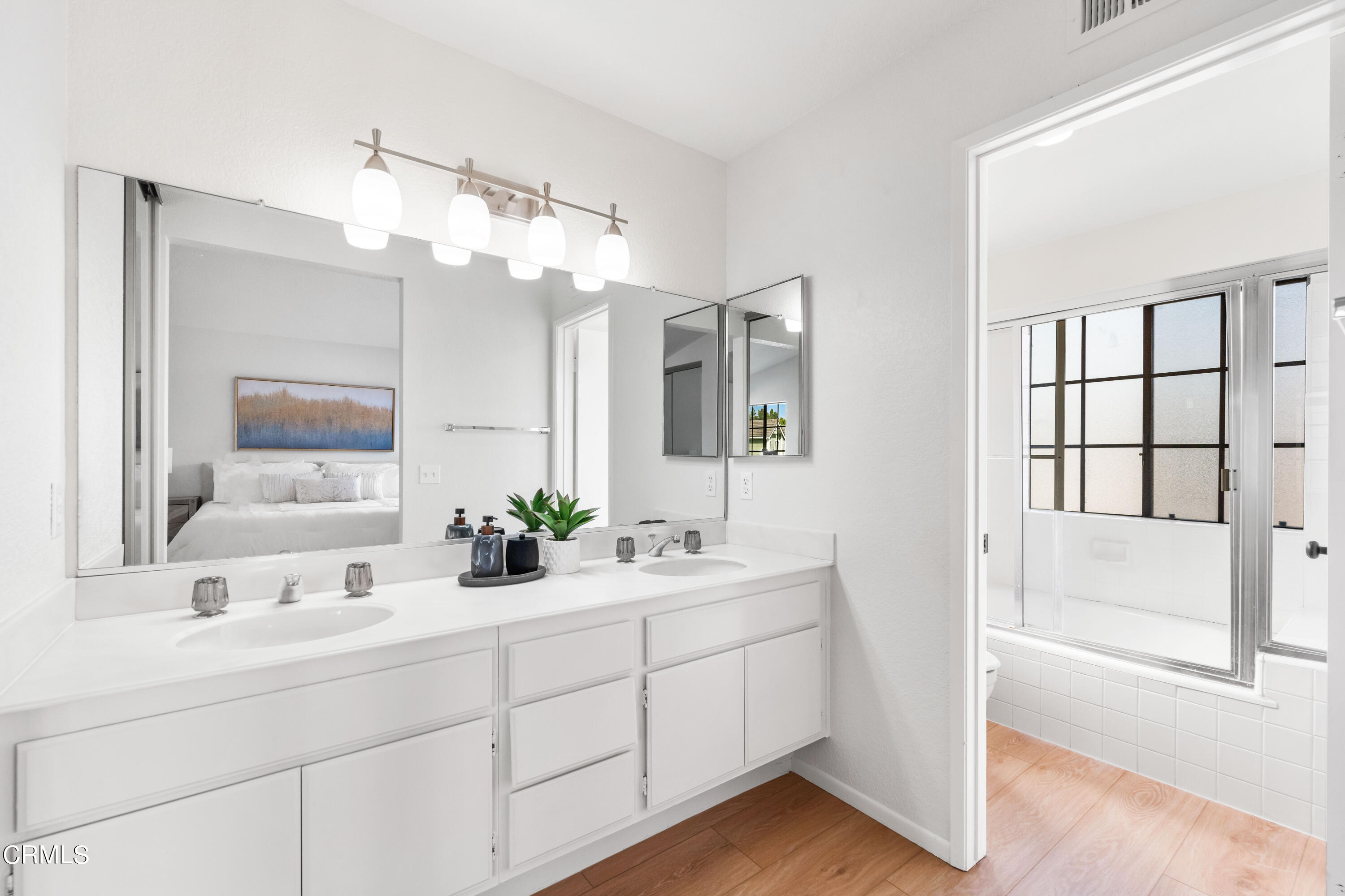 24 Silkberry Irvine, CA 92614 - Photo 18 of 33 a bathroom with a double vanity sink mirror and bathtub