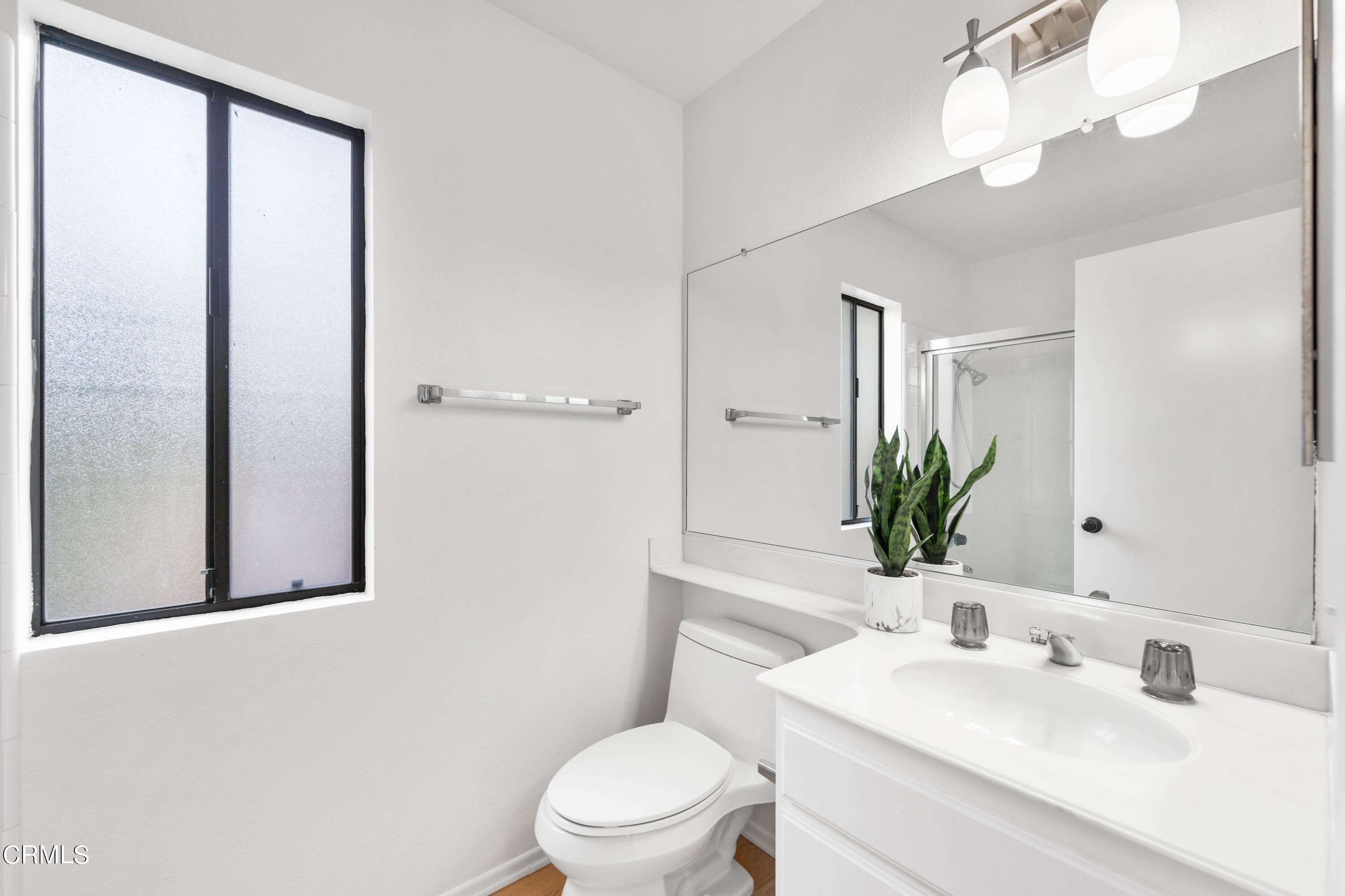 24 Silkberry Irvine, CA 92614 - Photo 20 of 33 a bathroom with a toilet a sink and a mirror