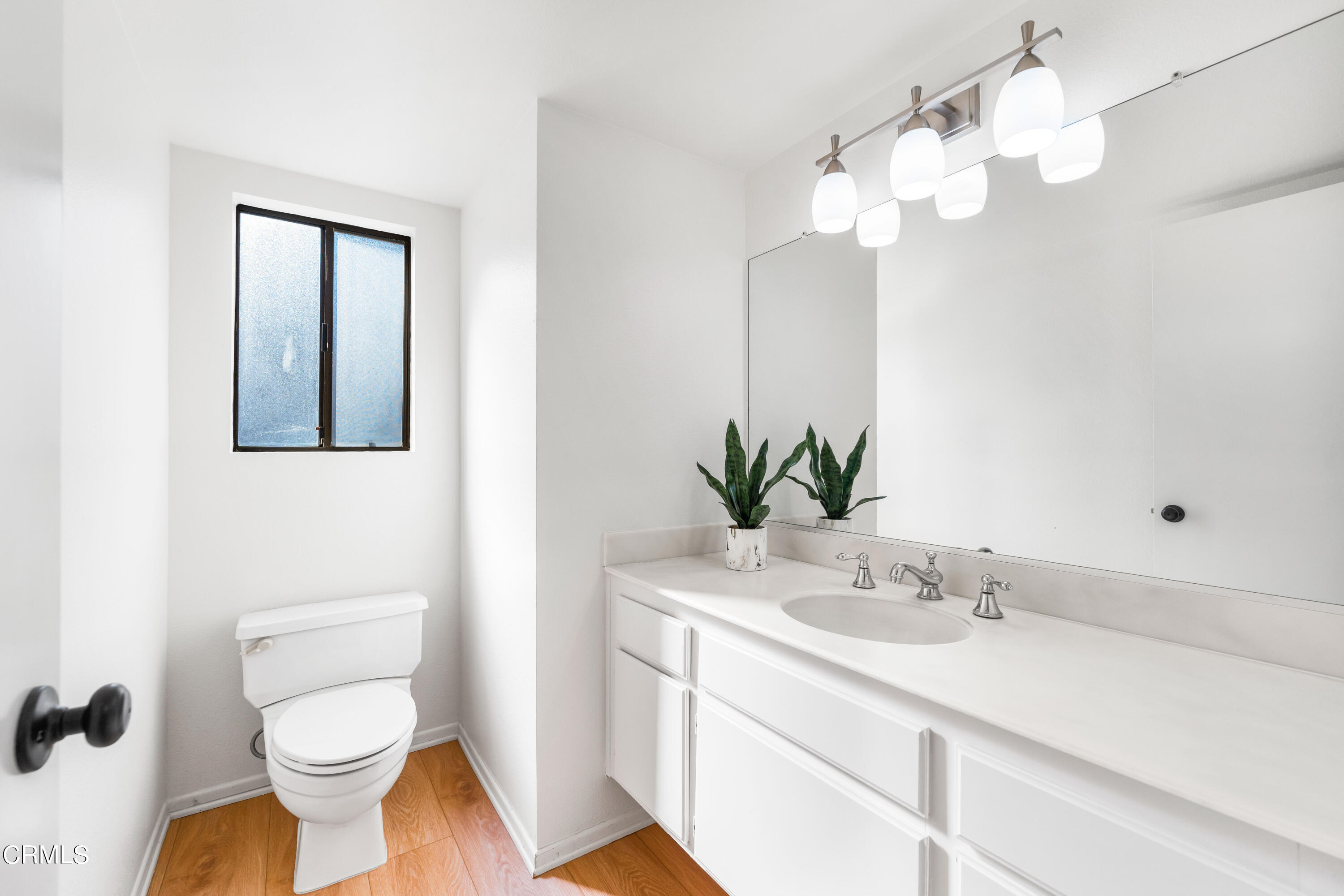 24 Silkberry Irvine, CA 92614 - Photo 22 of 33 a bathroom with a sink a toilet and a mirror