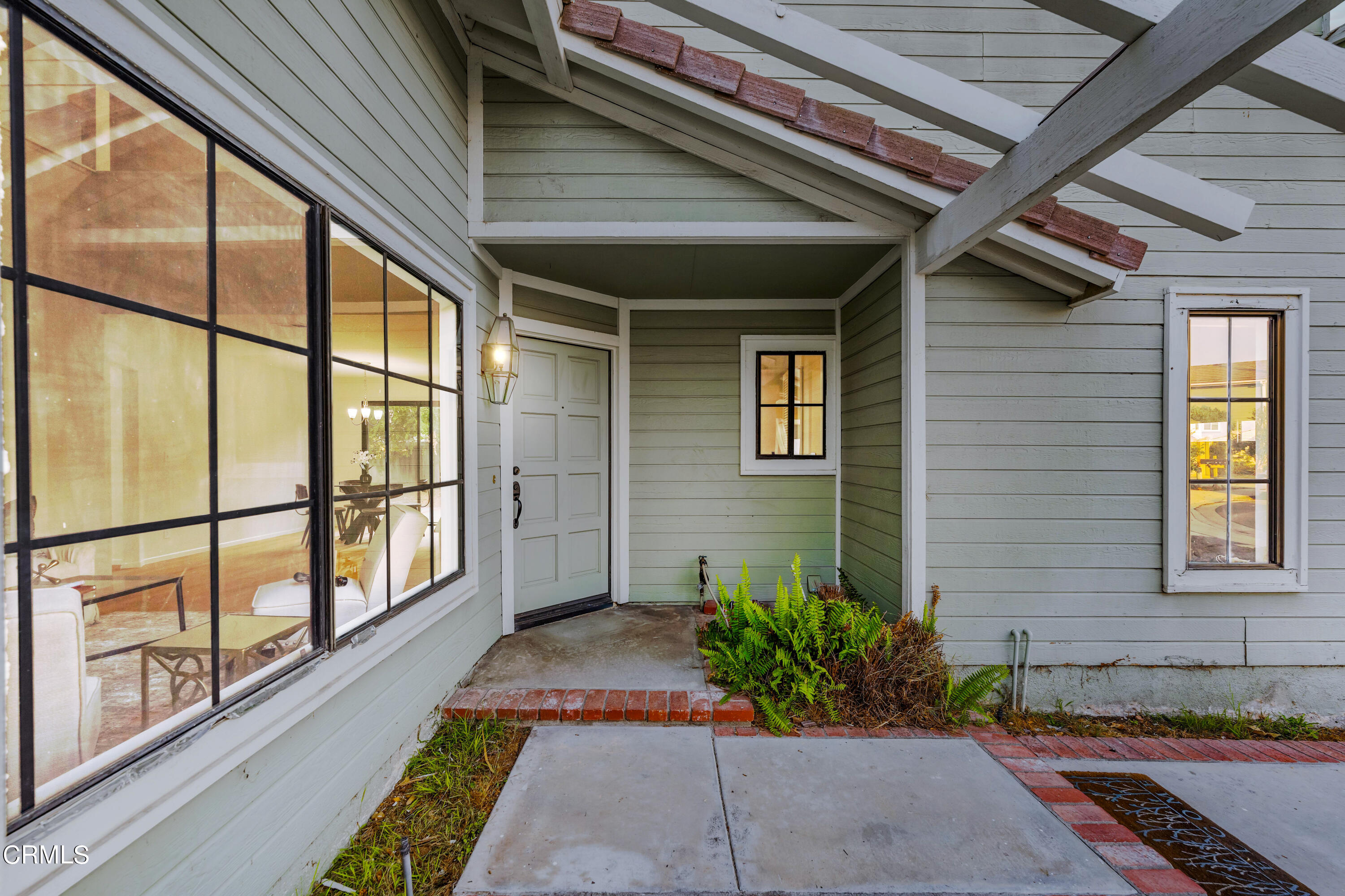 24 Silkberry Irvine, CA 92614 - Photo 3 of 33 a view of a porch with chairs and potted plants