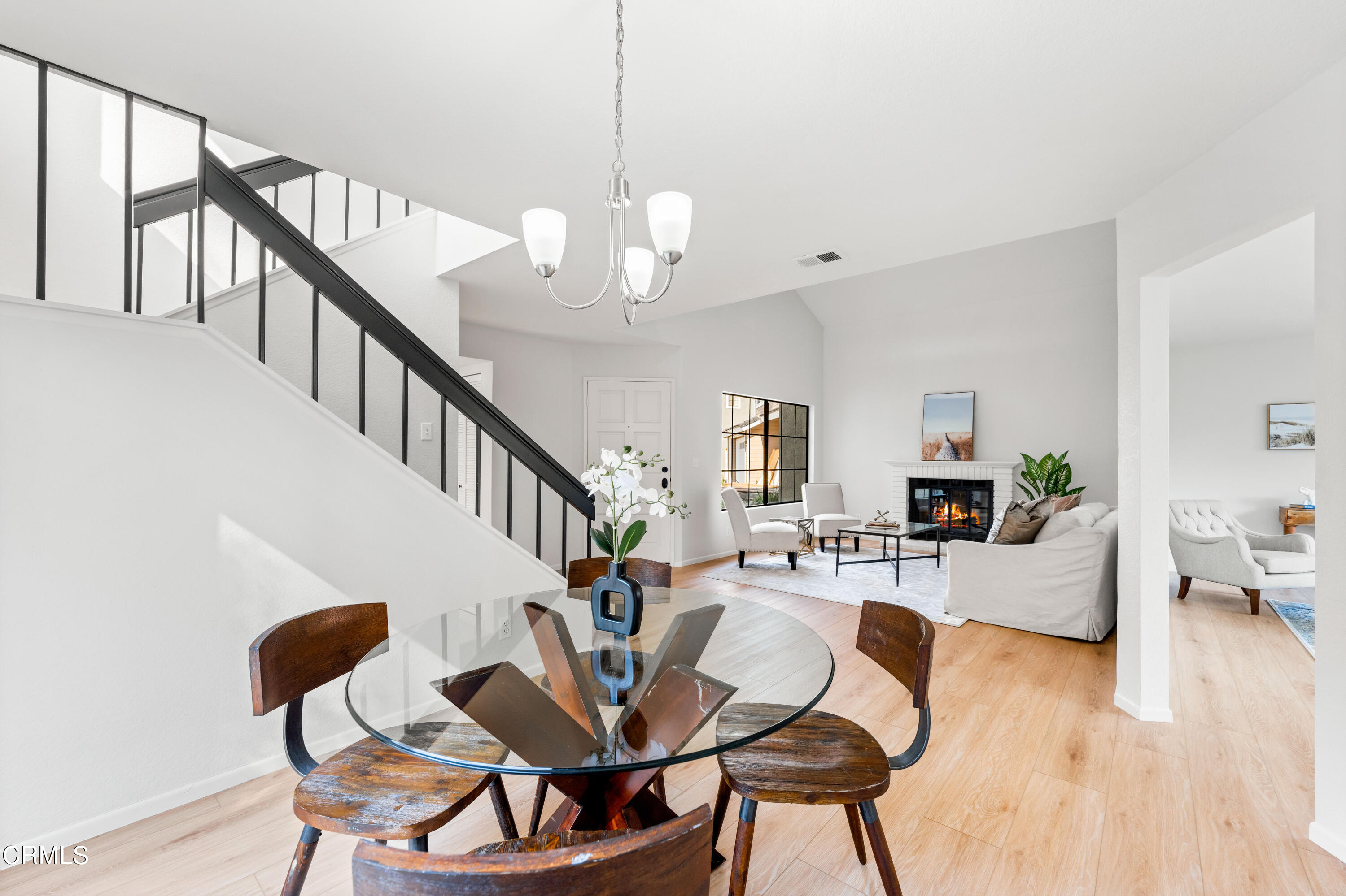 24 Silkberry Irvine, CA 92614 - Photo 8 of 33 a view of a dining room with furniture a livingroom and wooden floor