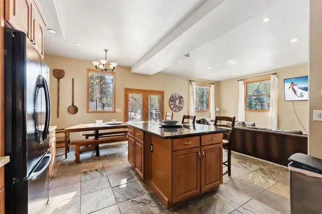 a kitchen with a sink stove and refrigerator