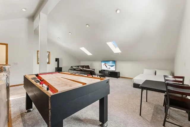 a living room with furniture and a table