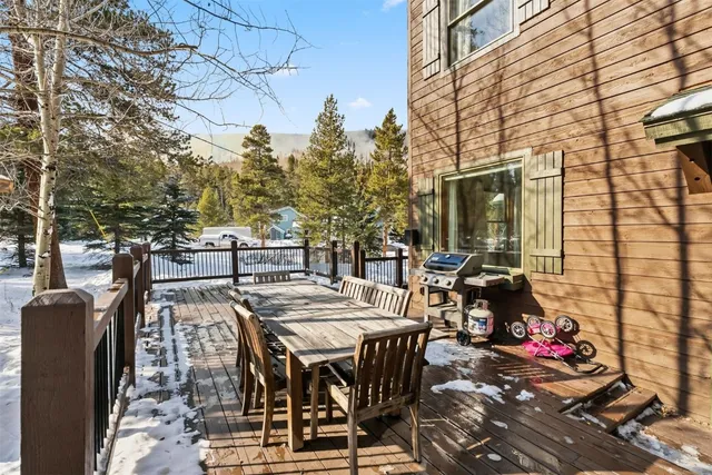 a view of a house with wooden fence