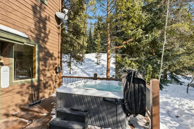 a view of a porch with wooden floor and outdoor space