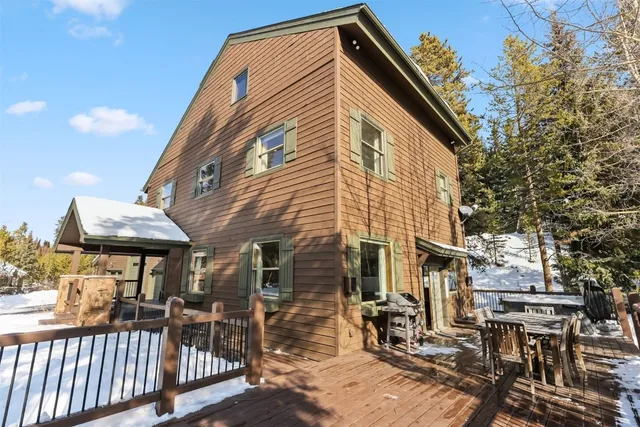 a view of a porch with wooden floor and fence