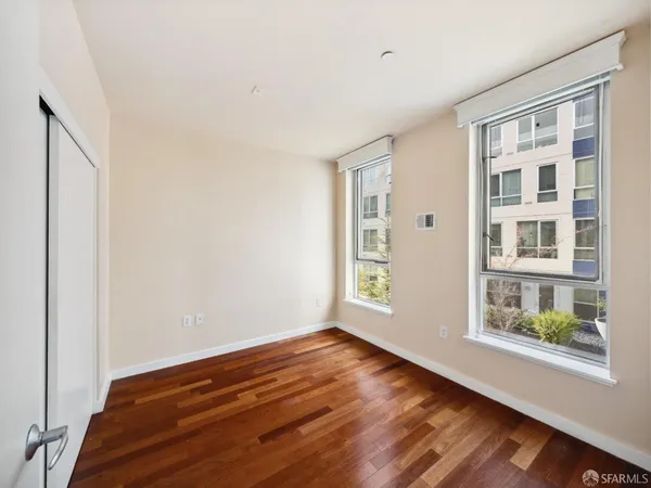 a view of room with window and hardwood floor