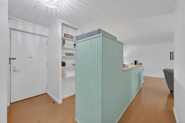 a view of livingroom with hardwood floor and cabinet