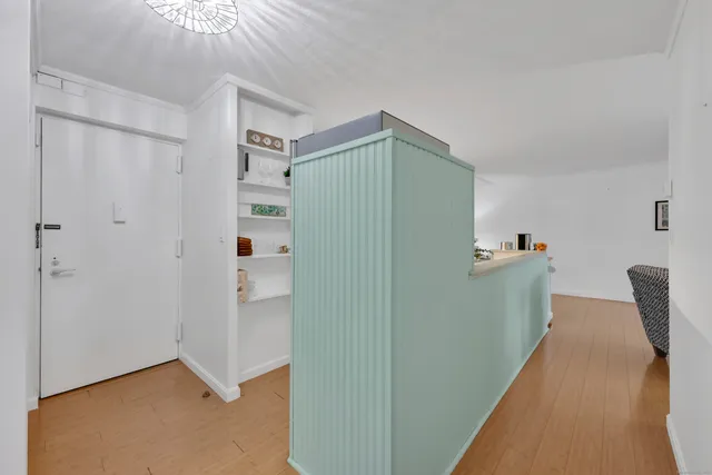 a view of livingroom with hardwood floor and cabinet