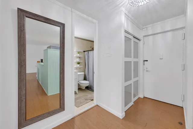 a view of a livingroom and a bathroom