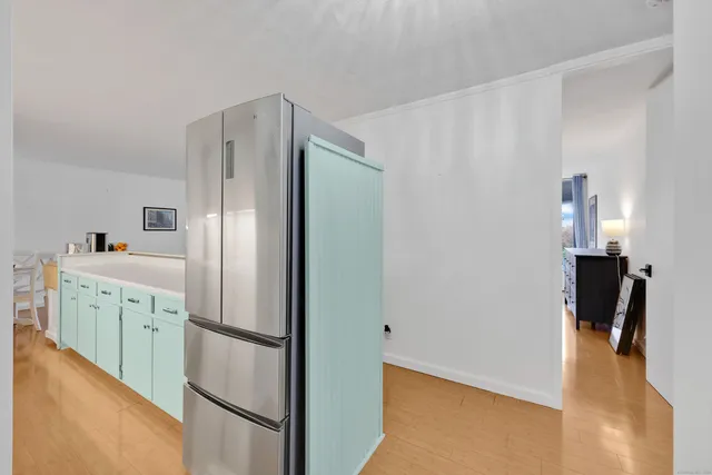 a kitchen with a refrigerator and a sink