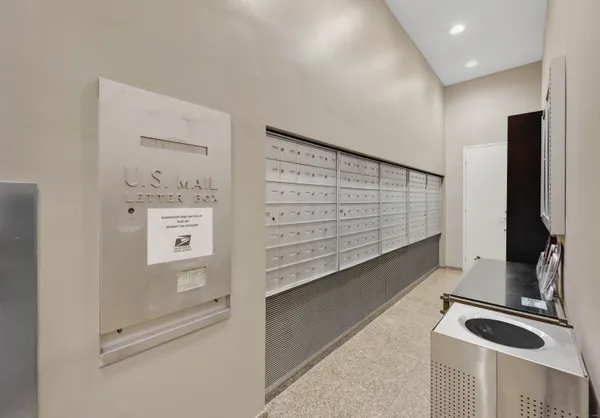 a view of walk in closet with clothes