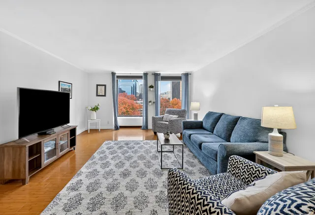 a living room with furniture and a flat screen tv