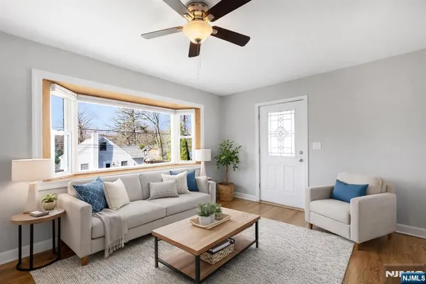 a living room with furniture and a large window