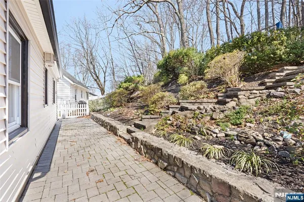 a view of a pathway with a yard