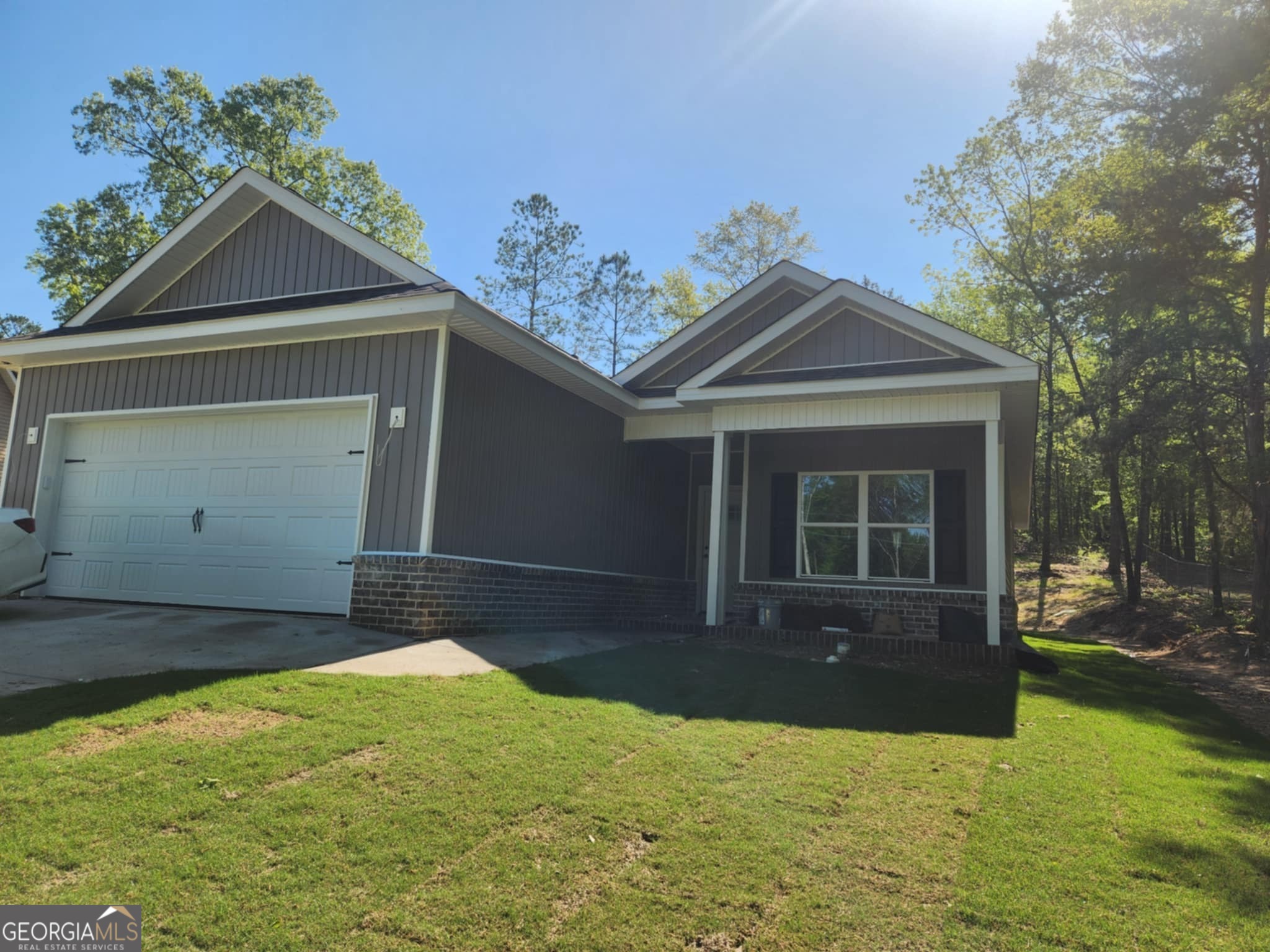 102 Silver Maple Court Byron, GA 31008 - Photo 1 of 17 a front view of a house with a yard and garage