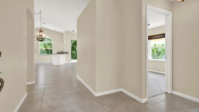 an empty room with windows and natural light