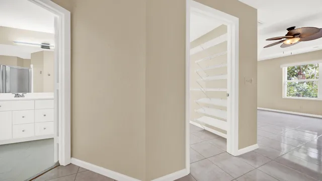 a bathroom with a granite countertop sink a mirror and a shower