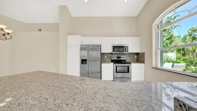 a spacious bathroom with double vanity a toilet a a bathtub and a shower