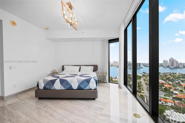 a bed room with bed and a large window