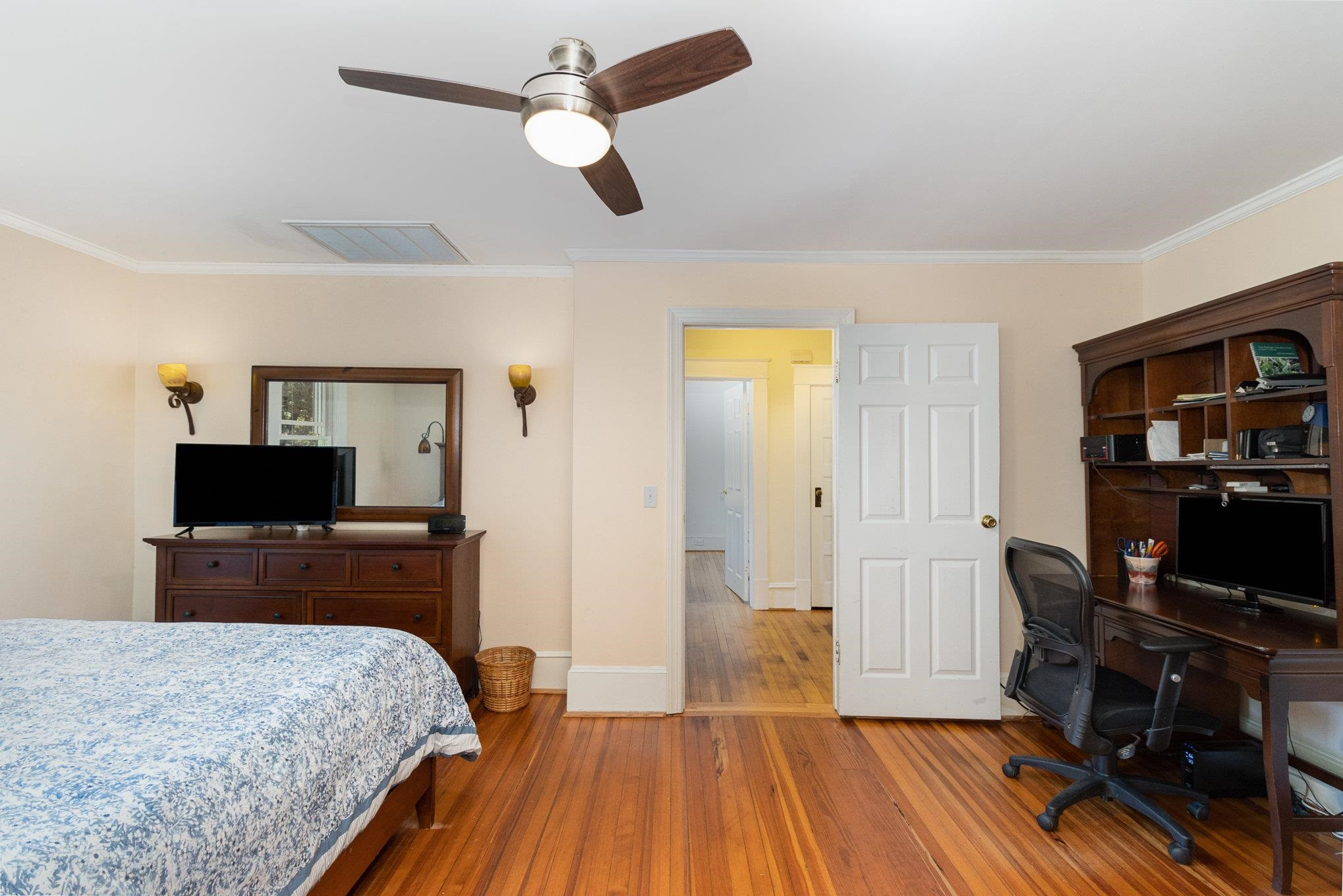 301 Duncan Street Raleigh, NC 27608 - Photo 15 of 41 Staircase to 2nd floor just outside this door is currently open as a single family lives here, but a door can easily be added back to separate if preferred for an in law suite/ duplex/ or Airbnb. 1st Floor Primary Bedroom