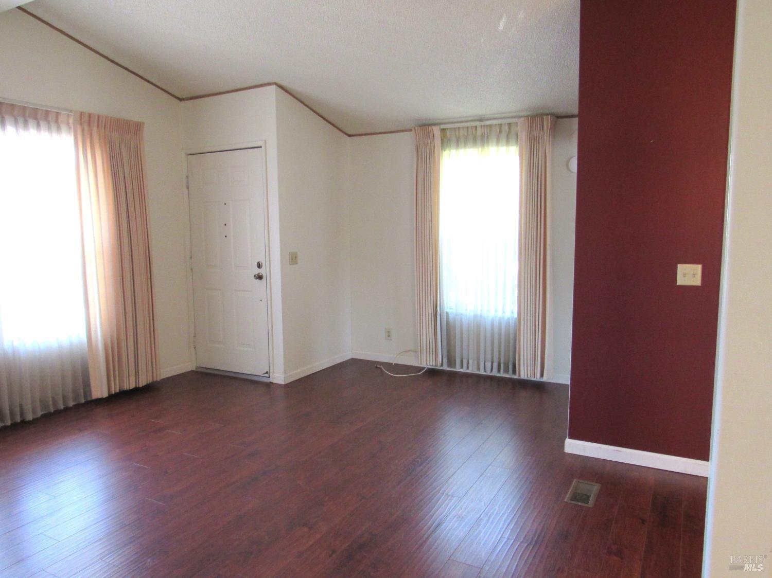 31 Ramon Street Sonoma, CA 95476 - Photo 12 of 24 an empty room with wooden floor and windows