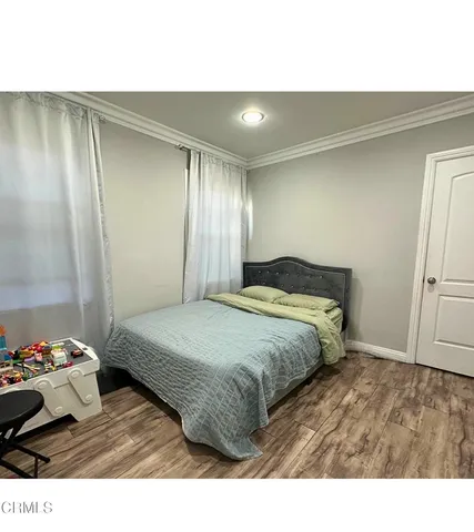 a bedroom with a bed and a walk in closet