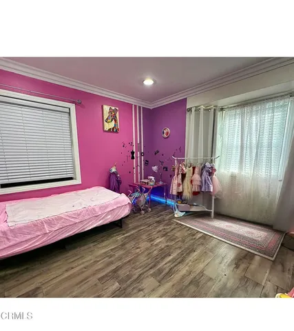 a bed room with a bed and a window